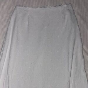 White maxi skirt with floral detail and scalloped lace at the top